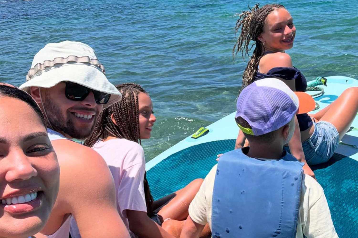 Ayesha Curry drops beachy snapshots from her family getaway with Steph and the kids, captioned: “Sand and sun vibes.”